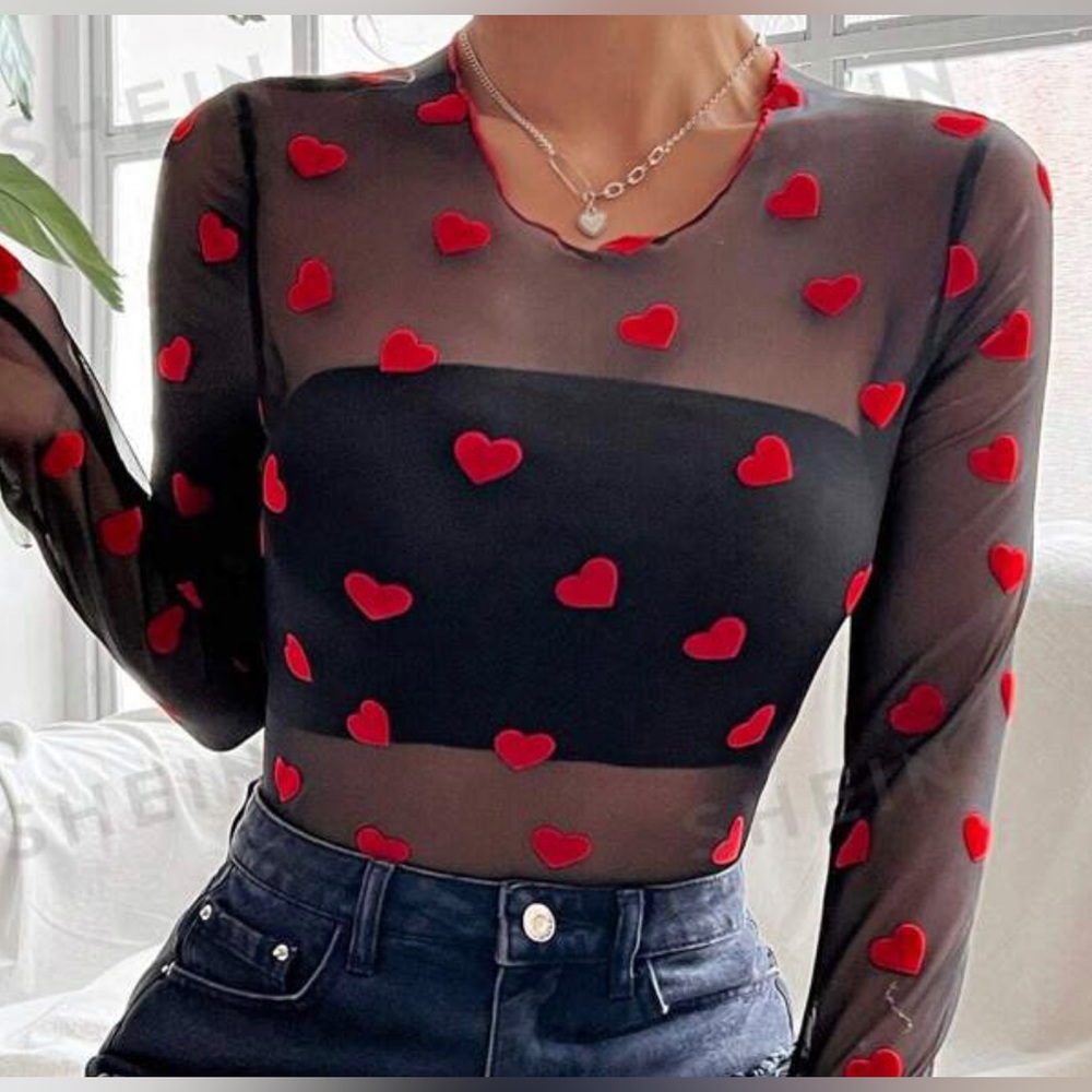 cute going out mesh heart bodysuit! worn once! size small!